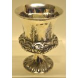 An early Victorian silver goblet, the campana shape body with repouse foliage and stiff leaves, on a
