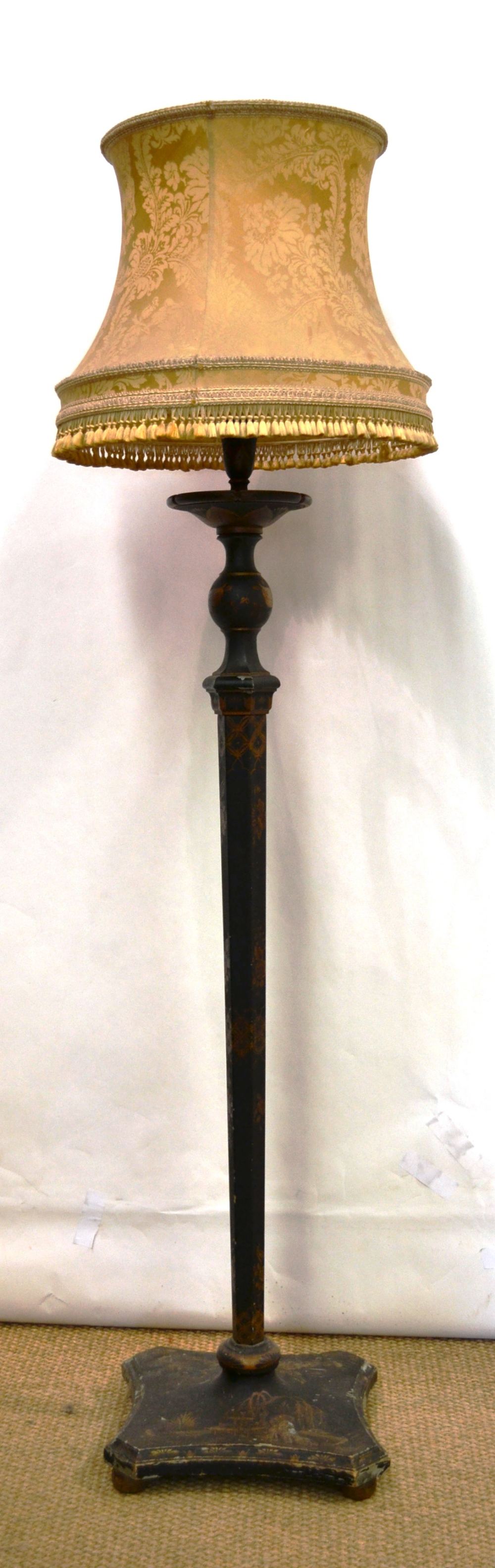 A black and gold lacquer decorated standard lamp with shade, the stem on a square concave base