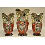 A garniture of three early Victorian Mason's Ironstone china vases, the panelled bodies decorated in