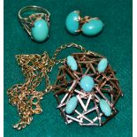 A pendant/ brooch, 1960 open style set with five opal turquoise cabochons. Concealed hanger and