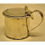 A George IV silver drum shape mustard, with a gadroon border, fitted a blue glass liner, the
