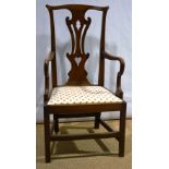A late eighteenth century elm masters chair, with a high pierced splat back shepherd crook arms, a