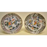 A pair of early nineteenth century Cantonese porcelain famillle verte plates decorated in coloured