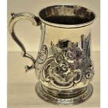 An early George III silver baluster mug, later chased with repousse foliage, a vacant cartouche a