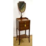An Edwardian mahogany shaving stand, the galleried top with a shield shape mirror on a brass