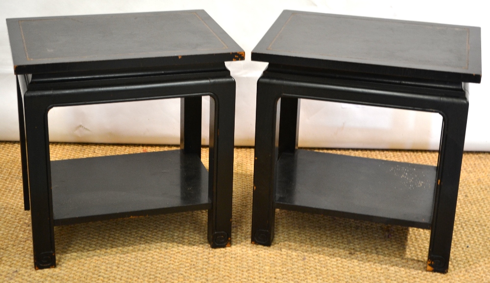 A pair of ebonised oriental style occasional tables, the rectangular tops inset black gilt tooled