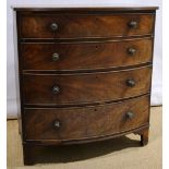 A Regency mahogany veneered bow front chest, inlaid stringing, the reeded edge top above four long