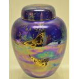 A Fieldings blue Devon lustre china jar and cover, decorated gilt butterflies. 9in (23cm).