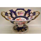 A Chamberlains Worcester dessert tazza, painted coloured flowers, in gilt bordered panels to a