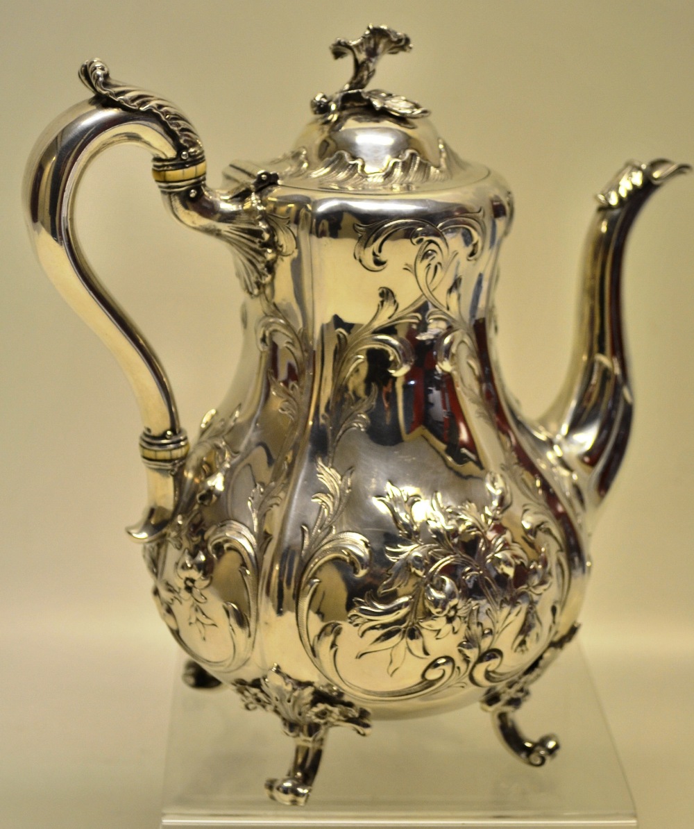 Hunt and Roskell late Storr and Mortimer. A Victorian silver rococo Revival coffee pot, the panelled