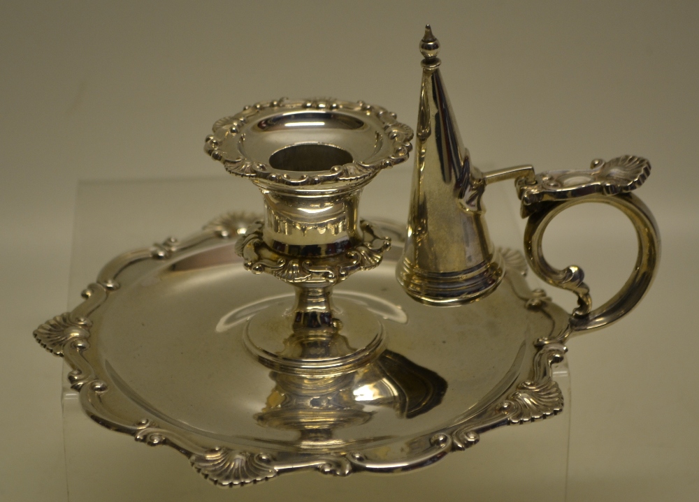 An Edwardian silver bedroom candlestick, with shell scroll borders, the candleholder with a