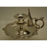 An Edwardian silver bedroom candlestick, with shell scroll borders, the candleholder with a