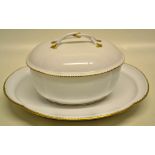 A late eighteenth century Sevres white porcelain, gilt banded sauce tureen, with panelled sides, the