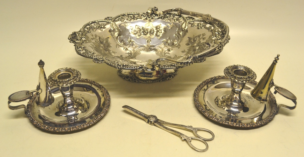 A Victorian oval swing handled electroplated cake basket, engraved foliage with pierced borders,