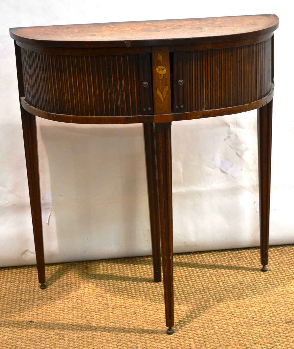 An early nineteenth century Dutch marquetry elliptical card table, veneered in walnut and inlaid