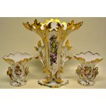 A matching garniture of three French nineteenth century porcelain vases, decorated painted flowers