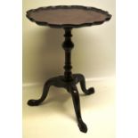 A mahogany occasional table, the circular top with a raised Bath edge border, the baluster turned