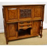 A Victorian oak and burr oak veneered secretaire, having fielded panels to the piano style case, the