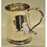 A George II silver pint mug, having a capped scroll handle, the tuck in base on a moulded foot.
