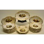 A William IV Derby porcelain dessert service, painted rural landscapes with gilt floral borders