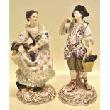 A pair of late nineteenth century Meissen porcelain figures of male and female grape harvesters,