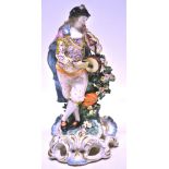 An eighteenth century Derby porcelain figure of a musician, blowing a flute and beating a