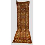 Kurdish runner, Kurdistan, north west Persia, early 20th century, 14ft. 11in. x 3ft. 11in. 4.55m.