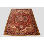 Heriz carpet, north west Persia, circa 1930s, 10ft. 11in. x 8ft. 3.33m. x 2.44m. Slight losses to