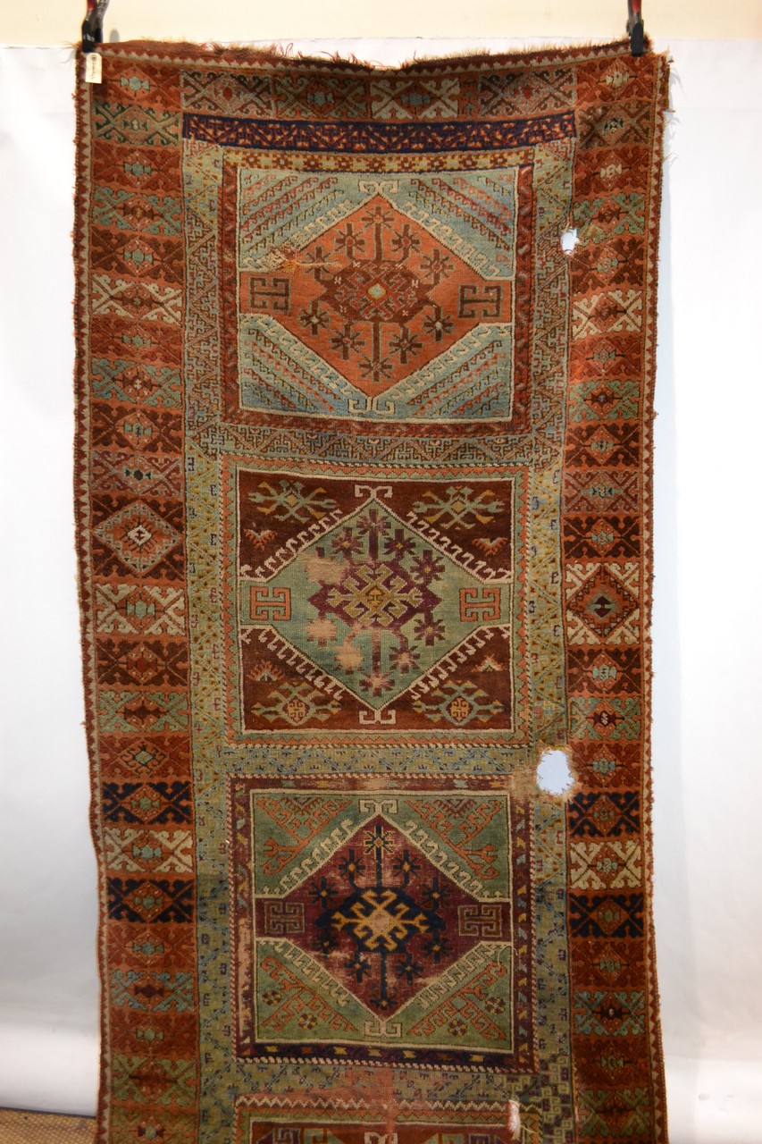 Yuruk long rug of panelled design, east Anatolia, second half 19th century, 14ft. 4in. x 4ft. 5in. - Image 4 of 4