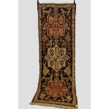 Akstafa long rug, Kazak district, south west Caucasus, early 20th century, 10ft. 8in. x 3ft. 11in.