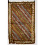 Quchan Kurd rug with multi-coloured diagonal striped field and an ivory star and medallion main