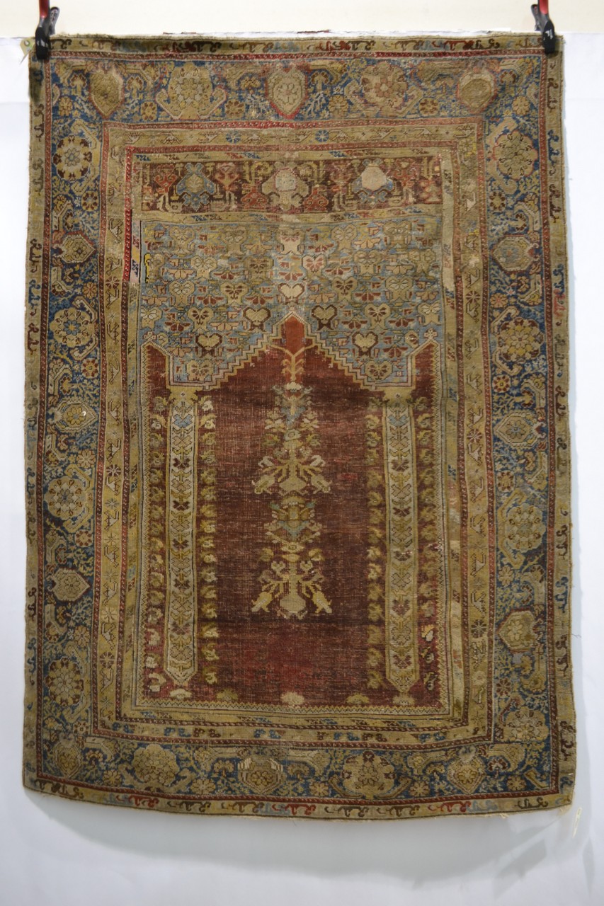 Ghiordes prayer rug, west Anatolia, 18th century, 5ft. 10in. x 4ft. 2in. 1.78m. x 1.27m. Overall