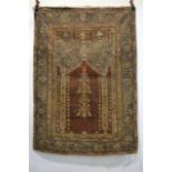 Ghiordes prayer rug, west Anatolia, 18th century, 5ft. 10in. x 4ft. 2in. 1.78m. x 1.27m. Overall