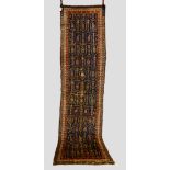 Kurdish ‘boteh’ runner, north west Persia, early 20th century, 11ft. 2in. x 2ft. 11in. 3.40m. x 0.