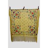 Chinese yellow silk reversible shawl, exquisitely embroidered in coloured silks with flowers and