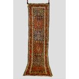 Karabakh runner, south west Caucasus, early 20th century, 11ft. 7in. x 3ft. 4in. 3.53m. x 1.02m.