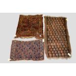 Three south west Persian weavings, all circa 1920s-30s, comprising a rug with brown field and all