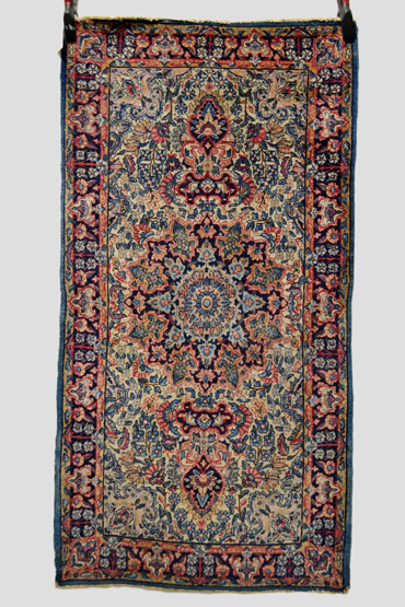 Kerman ivory field rug, south west Persia, circa 1940s-50s, 5ft. 1in. x 2ft. 8in. 1.55m. x 0.81m.