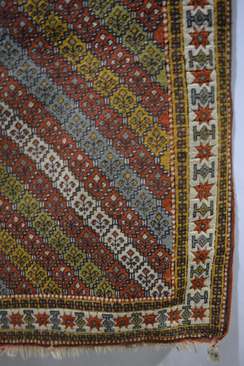 Quchan Kurd rug with multi-coloured diagonal striped field and an ivory star and medallion main - Image 3 of 5