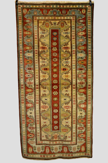 Melas rug, west Anatolia, modern, very narrow red field with central row of rosettes and multiple