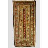 Melas rug, west Anatolia, modern, very narrow red field with central row of rosettes and multiple