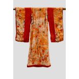 Japanese child’s printed silk kimono, with lightly padded hem, lined with orange silk and with red