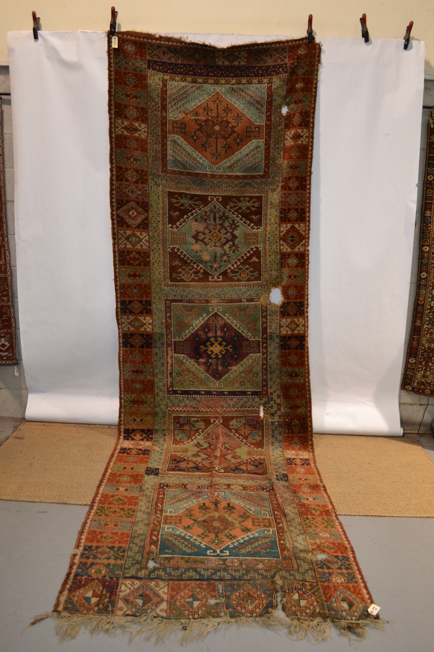 Yuruk long rug of panelled design, east Anatolia, second half 19th century, 14ft. 4in. x 4ft. 5in. - Image 3 of 4