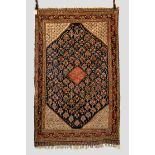 Exceptional silk wef­ted floral rug by the Kashkuli taifeh of the Qashqa’i Confederation, Fars,