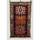 Kazak rug, south west Caucasus, circa 1930s-40s, 9ft. 2in. x 5ft. 5in. 2.80m. x 1.65m. Holes/