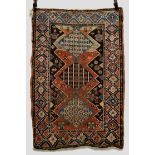 Kurdish rug, north west Persia, early 20th century, 4ft. 6in. x 3ft. 1.37m. x 0.91m. Overall wear;