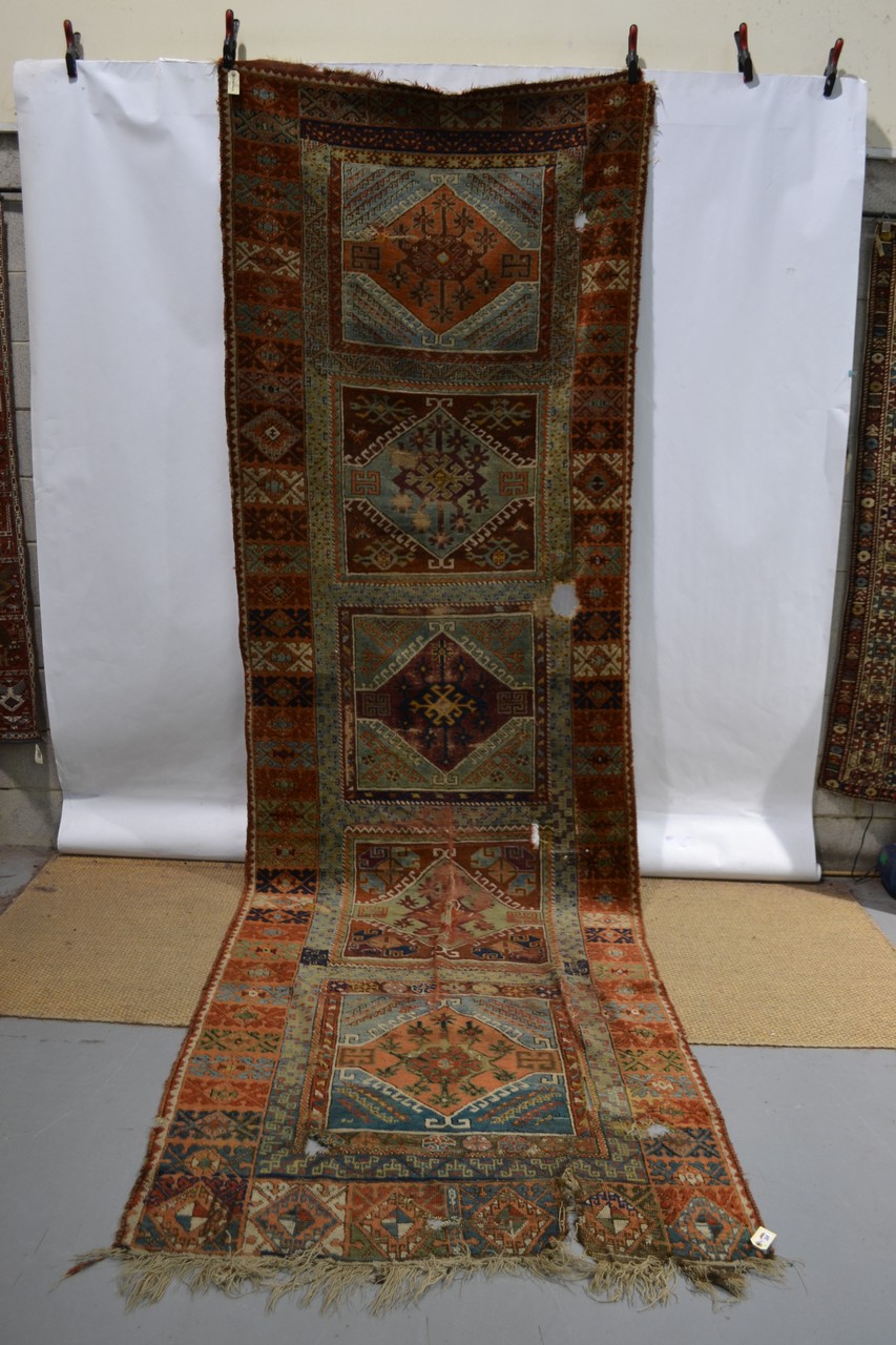 Yuruk long rug of panelled design, east Anatolia, second half 19th century, 14ft. 4in. x 4ft. 5in.