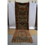 Yuruk long rug of panelled design, east Anatolia, second half 19th century, 14ft. 4in. x 4ft. 5in.