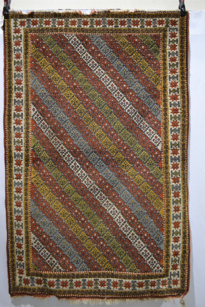 Quchan Kurd rug with multi-coloured diagonal striped field and an ivory star and medallion main - Image 2 of 5
