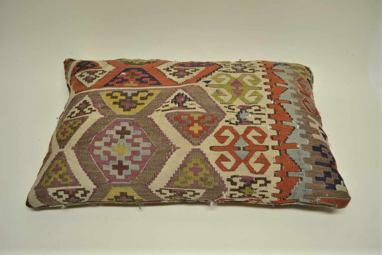 Anatolian kelim cushion, late 19th century, 2ft. 3in. x 1ft. 5in. 0.69m. x 0.43m. Some repairs.